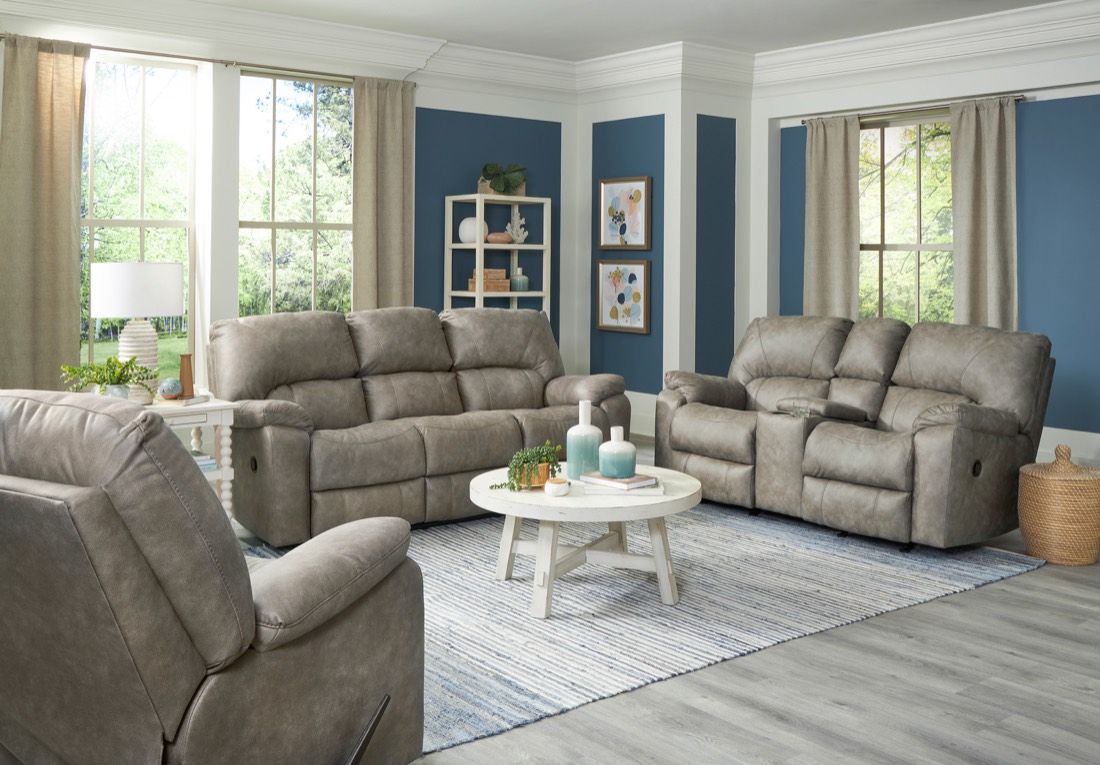Taupe reclining sofa, loveseat and recliner set styled in a living room — in stock at BoxDrop of Angola