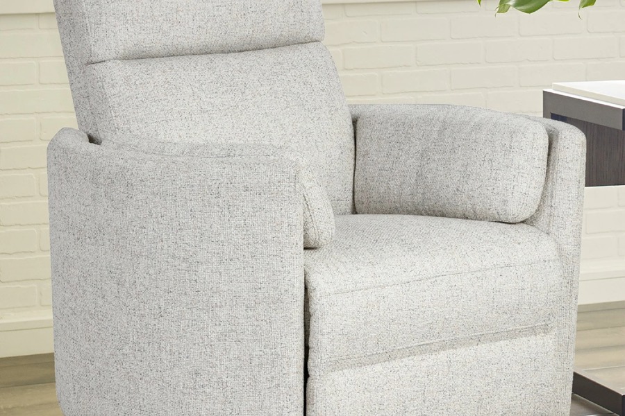 Light gray swivel glider recliner styled in a living room — in stock at BoxDrop of Angola