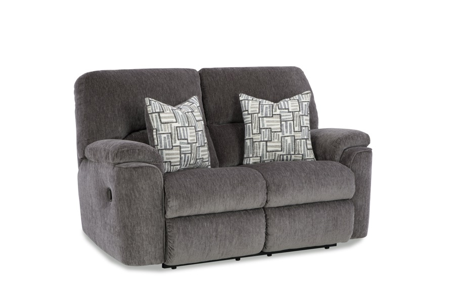 Gray reclining loveseat with accent pillows, brand new in plastic, at BoxDrop of Angola