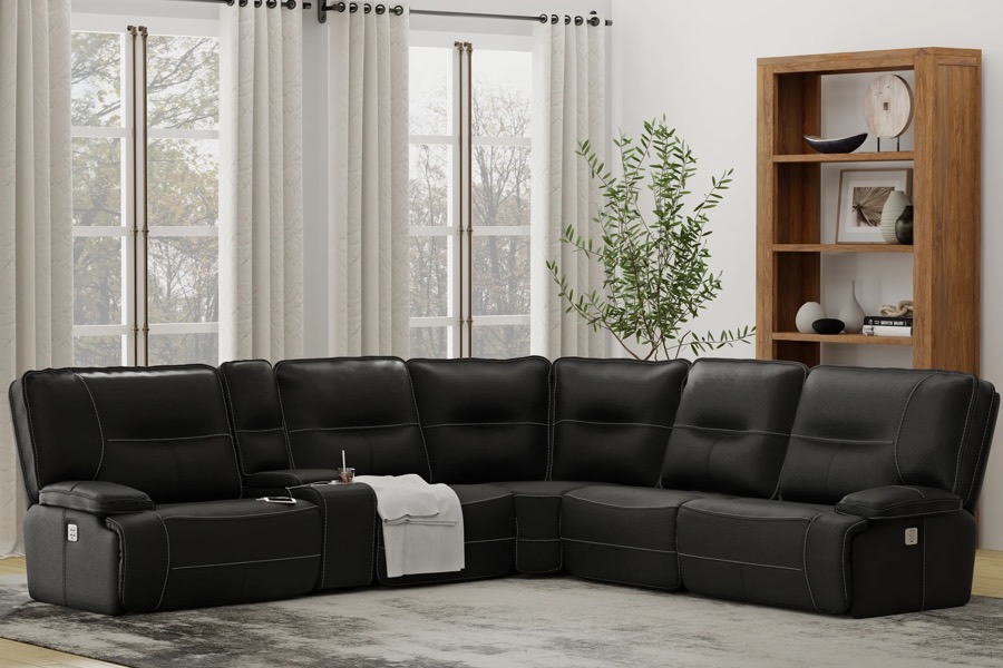 Black leather power reclining sectional, brand new and in plastic, on the showroom floor at BoxDrop of Angola