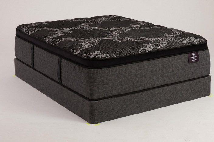 Plush pillowtop mattress with damask top on a base